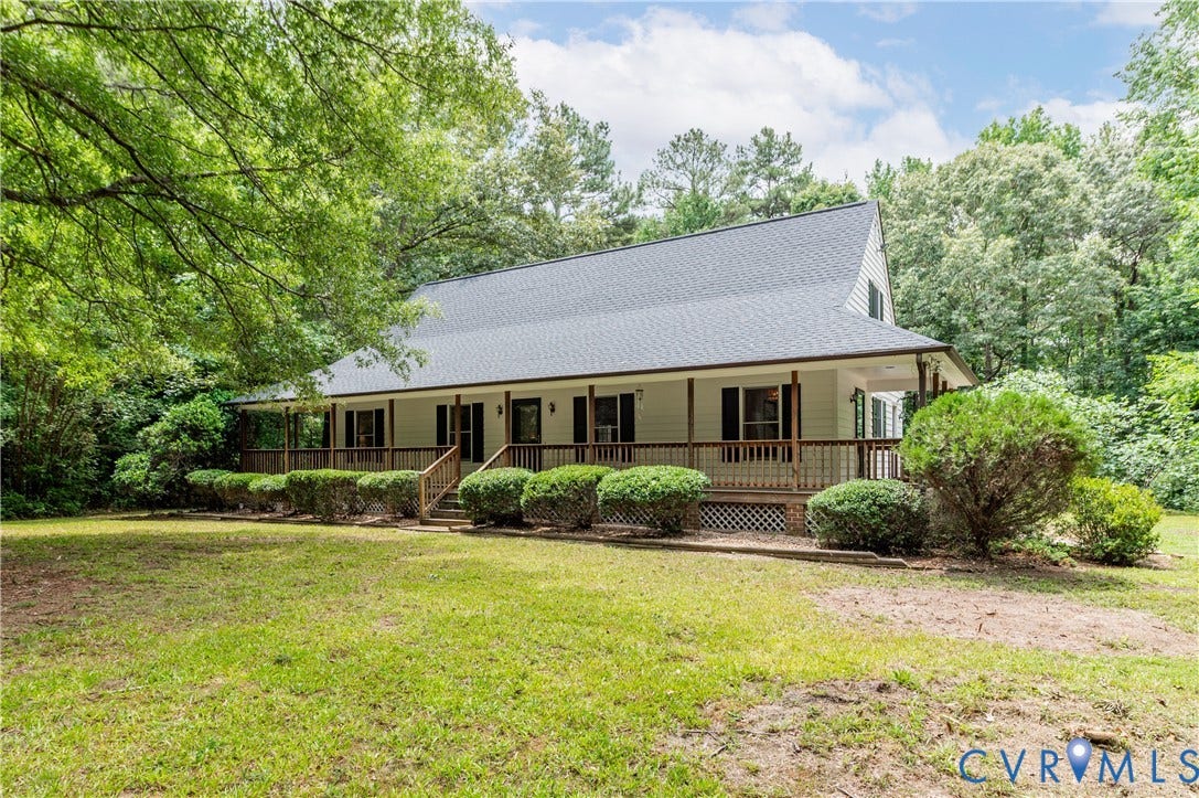 4415 Spoonbill Drive, Powhatan, VA 23139 Expansive front porch with wood railings and lattice skirting