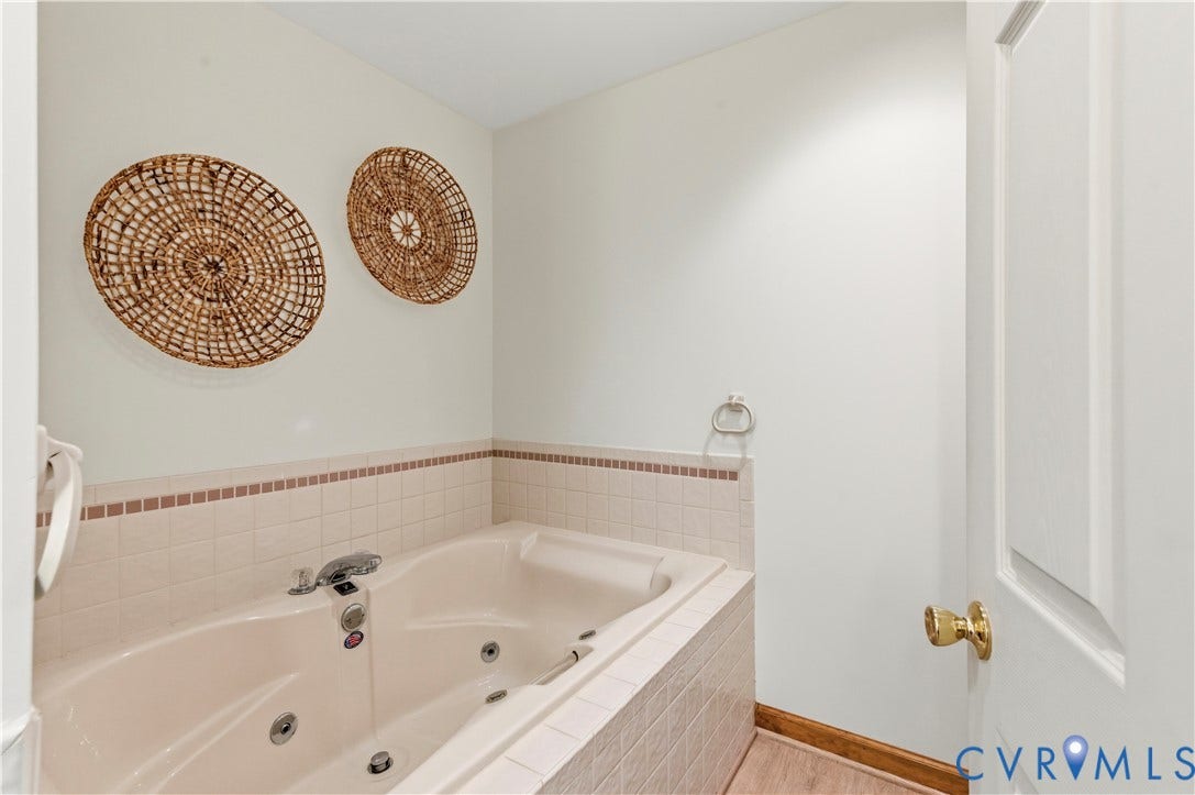 4415 Spoonbill Drive, Powhatan, VA 23139 Built-in soaking tub featuring tiled surround and accent trim