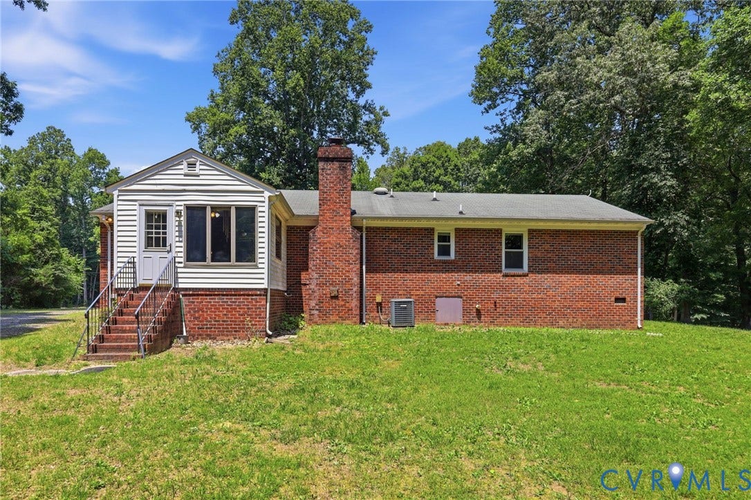 10111 Tunstall Road, New Kent, VA 23124 Brick exterior with a prominent brick chimney and white siding accent