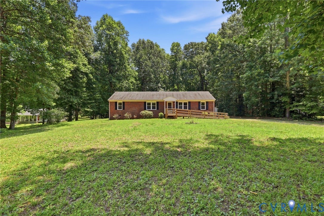 10111 Tunstall Road, New Kent, VA 23124 Brick exterior with a gabled roof and white trim
