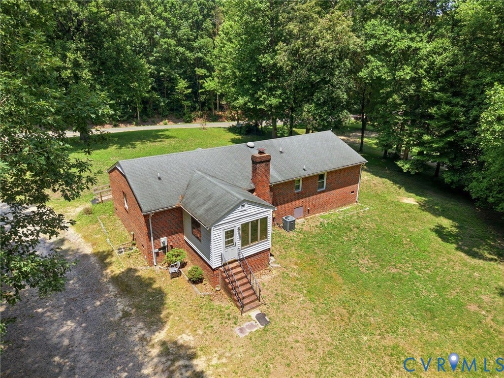 10111 Tunstall Road, New Kent, VA 23124 Brick exterior residence featuring a gabled roof and a prominent chimney