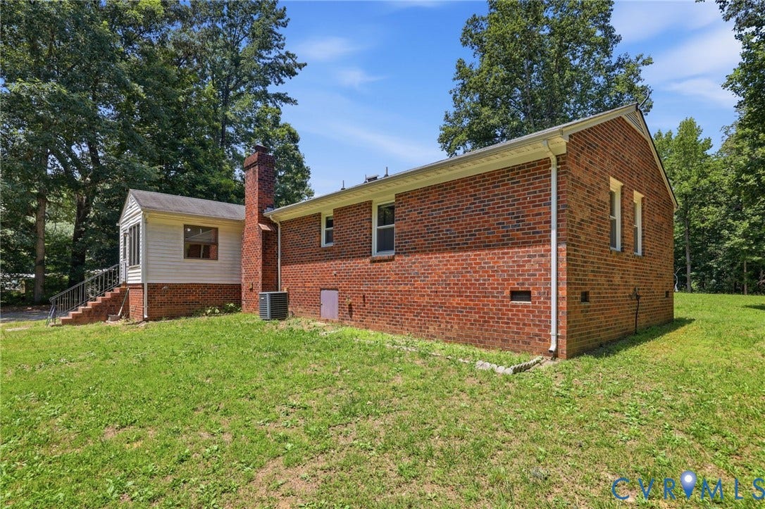 10111 Tunstall Road, New Kent, VA 23124 Brick exterior with white gutters and trim