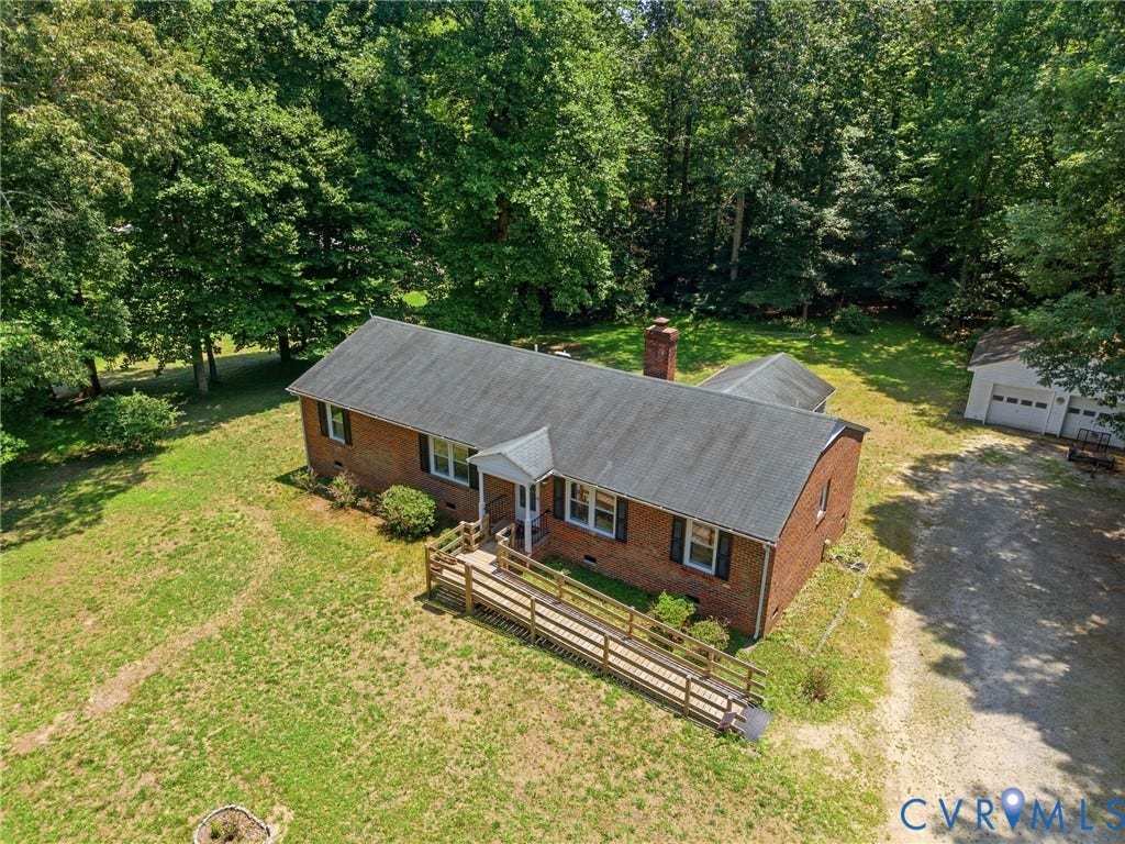 10111 Tunstall Road, New Kent, VA 23124 Brick exterior home with a dark shingle roof and white-trimmed windows