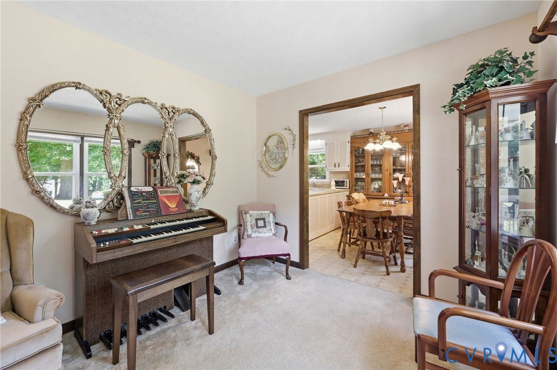 10111 Tunstall Road, New Kent, VA 23124 Carpeted interior space with a wide doorway revealing a separate dining area