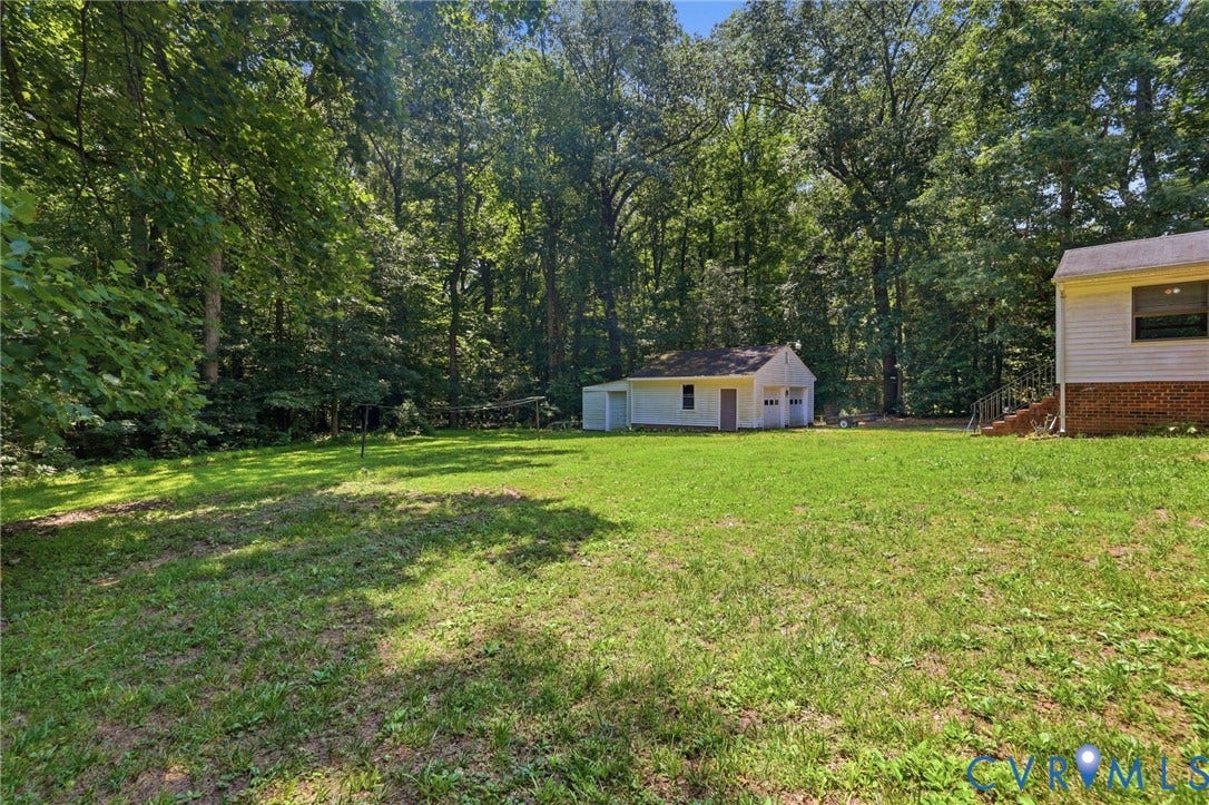 10111 Tunstall Road, New Kent, VA 23124 Expansive green lawn surrounded by mature trees