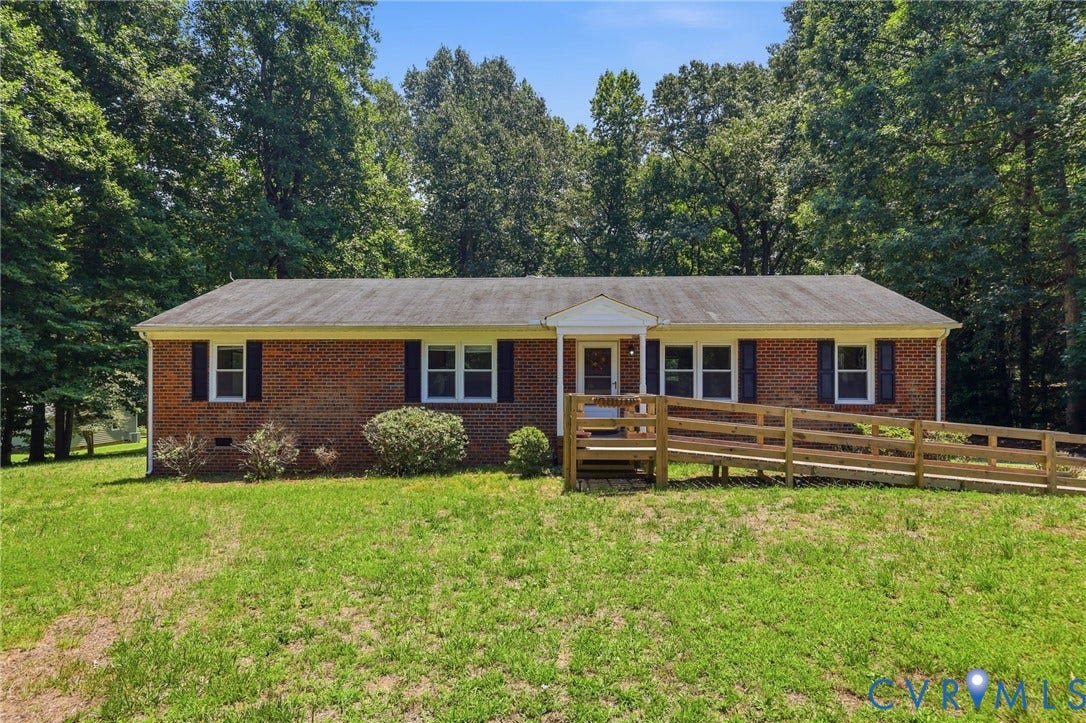 10111 Tunstall Road, New Kent, VA 23124 Brick ranch-style residence featuring a prominent wooden ramp entry