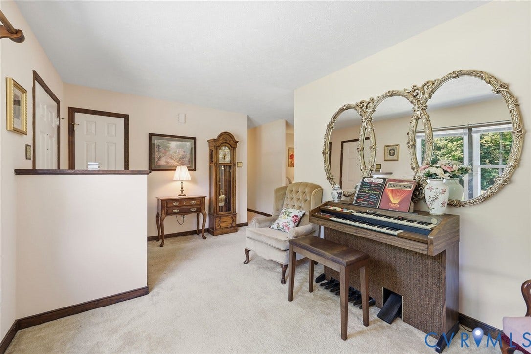 10111 Tunstall Road, New Kent, VA 23124 Carpeted interior area featuring light-toned walls and dark wood trim