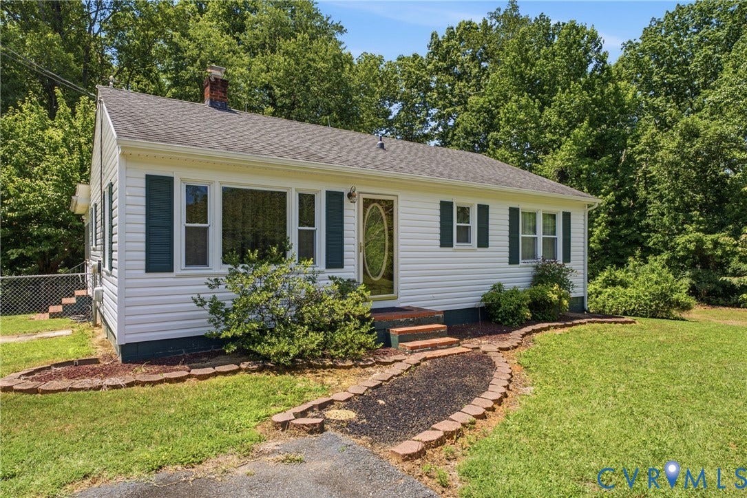 303 W 8th Street, Town Of Mineral, Mineral, VA 23117 White siding exterior with dark shutters