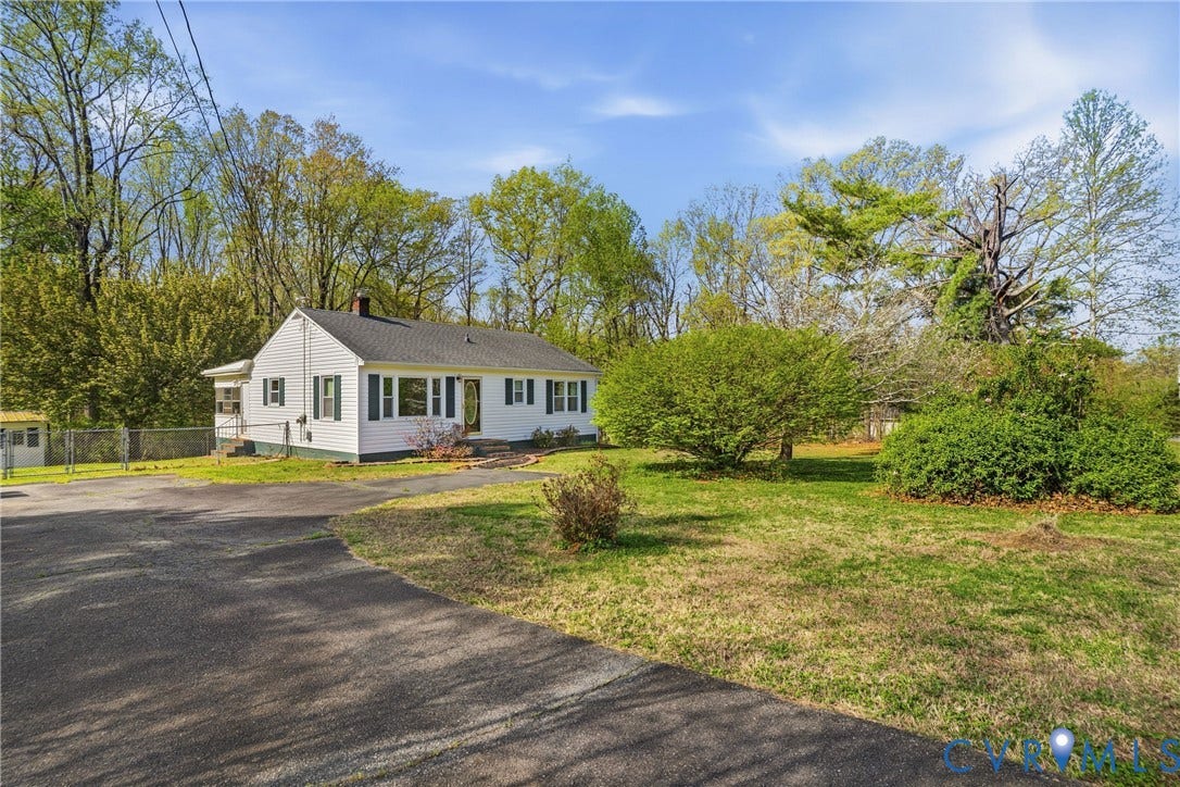 303 W 8th Street, Town Of Mineral, Mineral, VA 23117 White siding residence with dark shutters
