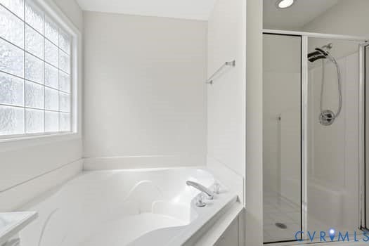 5213 Wheat Ridge Place, Chappell Ridge, Glen Allen, VA 23059 Soaking tub with polished chrome fixtures, featuring a privacy glass window
