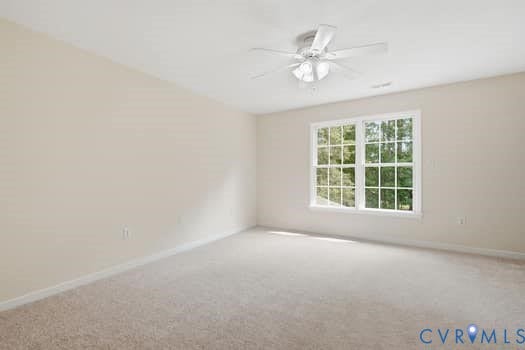 5213 Wheat Ridge Place, Chappell Ridge, Glen Allen, VA 23059 Neutral-toned room featuring a large window with white trim, a ceiling fan with light fixture, light-colored carpeting, and painted walls
