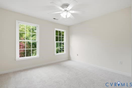 5213 Wheat Ridge Place, Chappell Ridge, Glen Allen, VA 23059 Bright room featuring two large multi-pane windows, light-toned carpeting, and a ceiling fan with integrated lighting