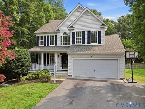 5213 Wheat Ridge Place, Chappell Ridge, Glen Allen, VA 23059 Two-story home with white siding, dark shutters, an attached garage, and a covered front porch featuring white railings