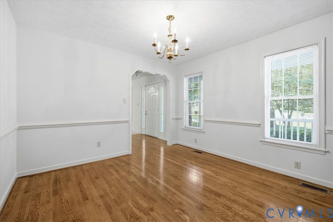 Formal Dining Room with hardwood floors.