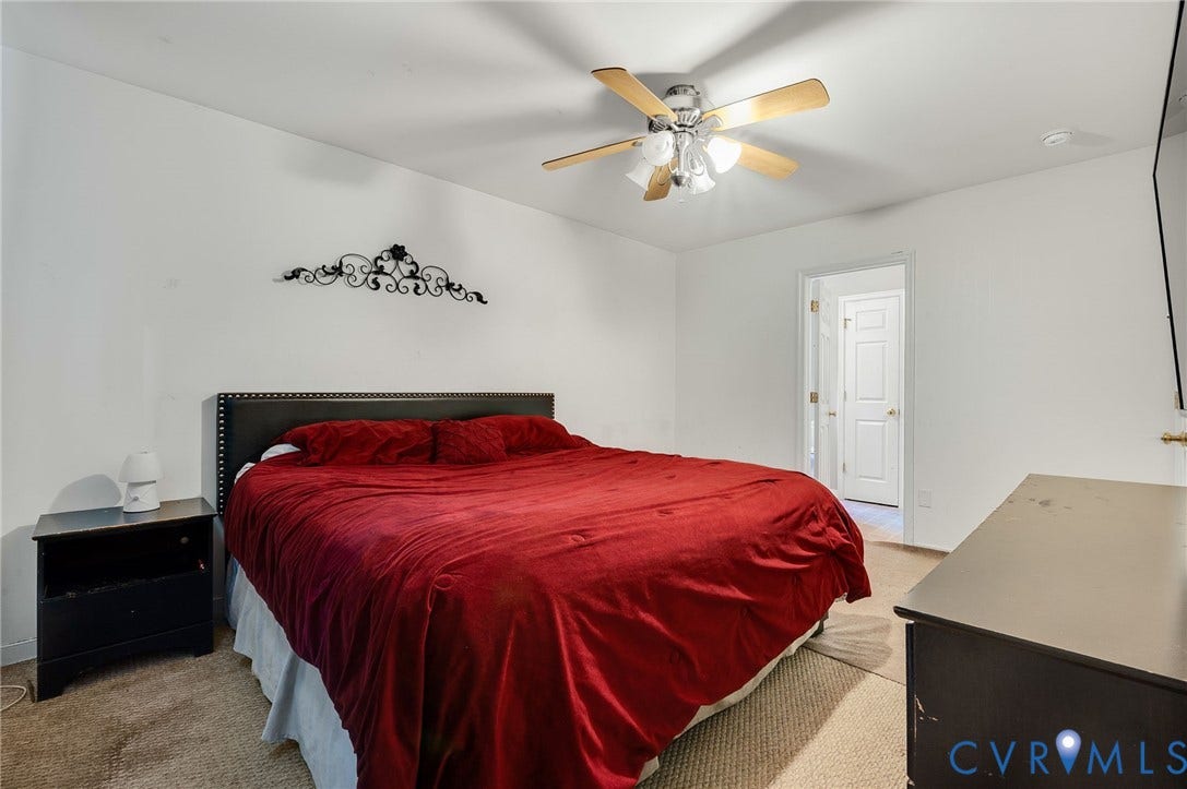 1207 Wycliff Court, Richmond, VA 23236 Carpeted room with a ceiling fan, white walls, and a visible doorway