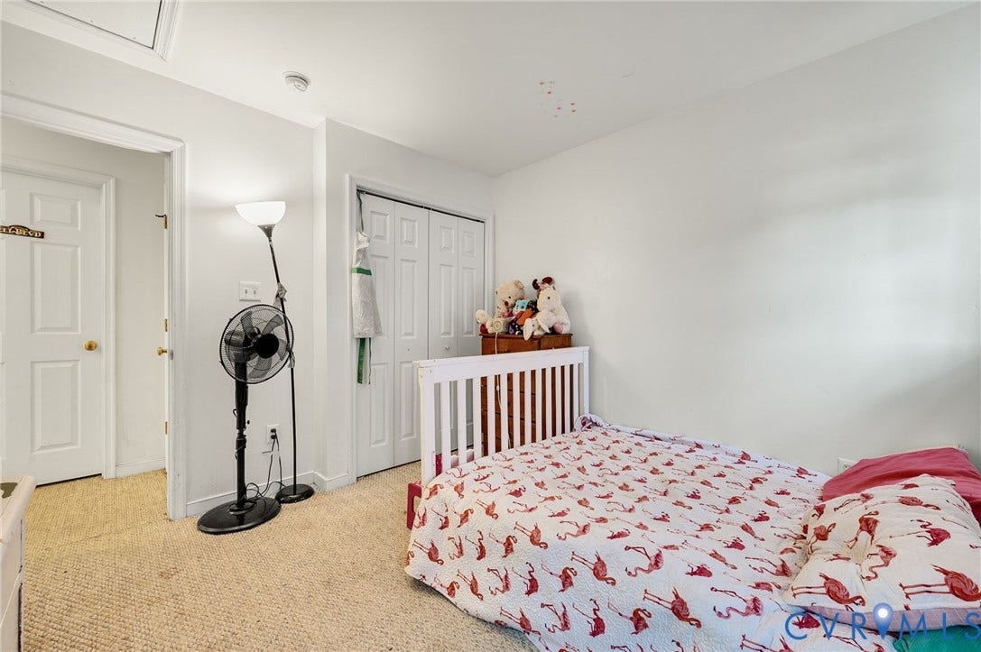 1207 Wycliff Court, Richmond, VA 23236 Bright interior room featuring neutral wall paint and textured carpeting