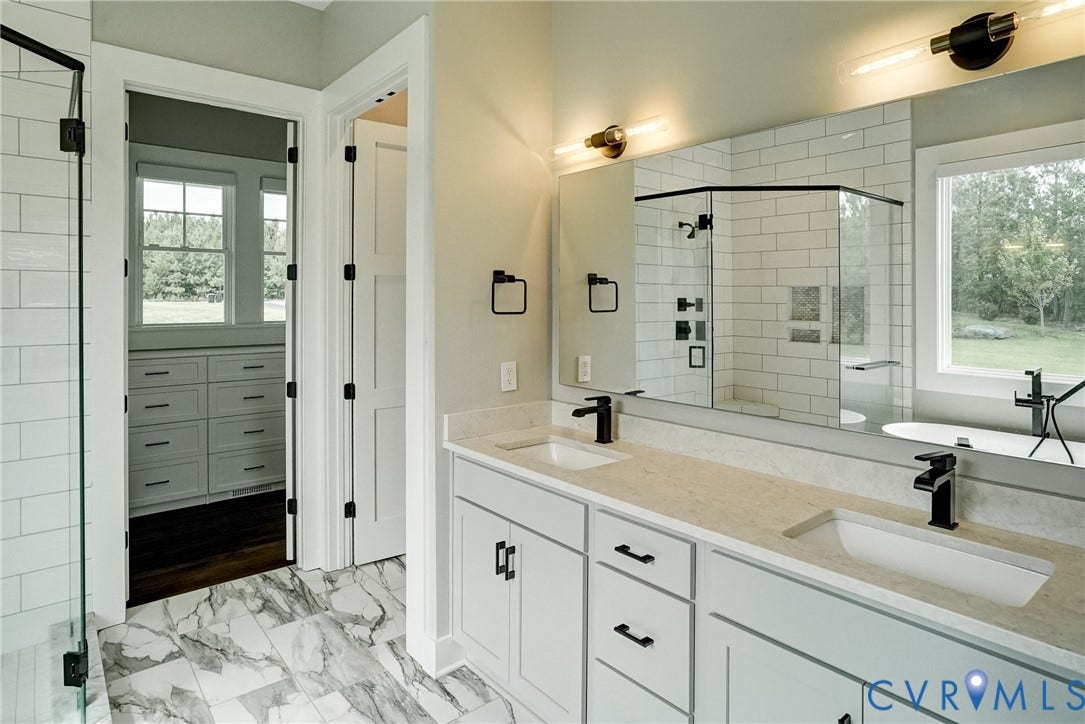 1732 Fishers Pond Drive, Maidens, VA 23102 Bathroom featuring a double vanity with light-colored countertops and black fixtures