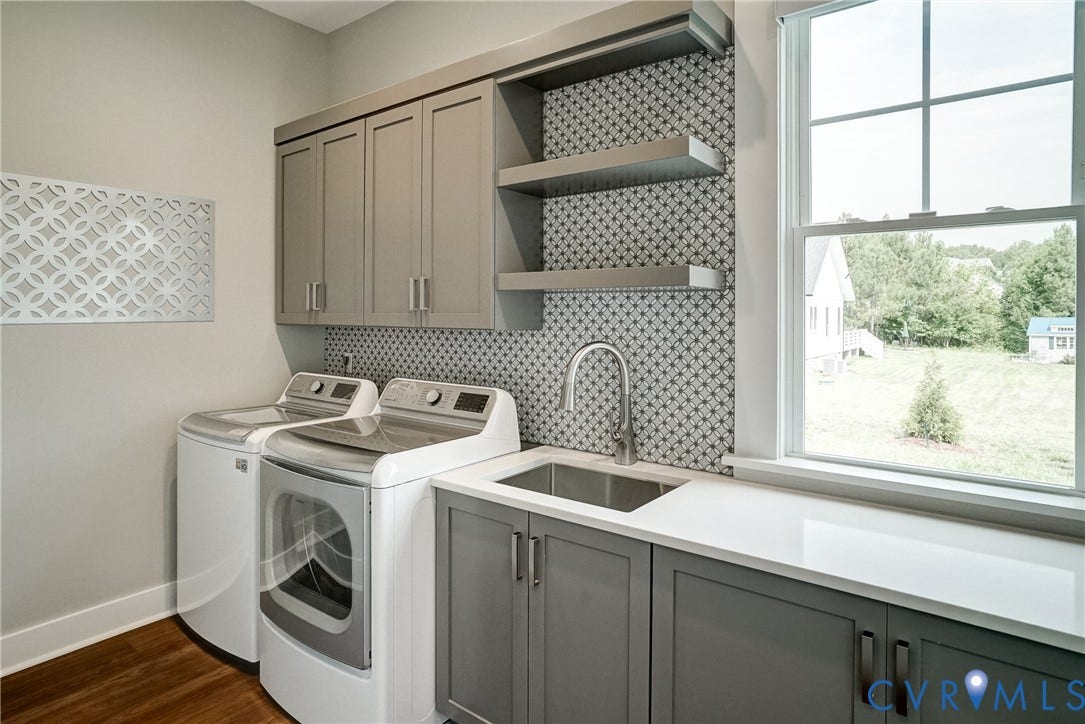 1732 Fishers Pond Drive, Maidens, VA 23102 Utility room featuring a built-in sink with a gooseneck faucet, gray cabinetry, open shelving, and a patterned tile backsplash