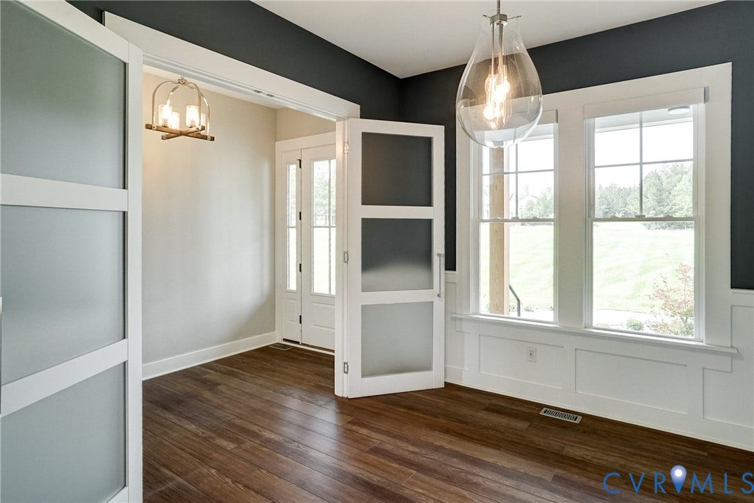 1732 Fishers Pond Drive, Maidens, VA 23102 Room with dark wood-finish flooring and two-tone wall paint