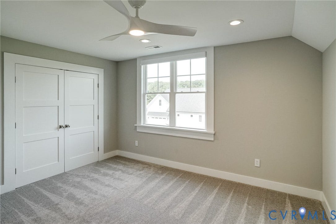1732 Fishers Pond Drive, Maidens, VA 23102 Neutral tone walls with white trim, a double-pane window, and recessed lighting