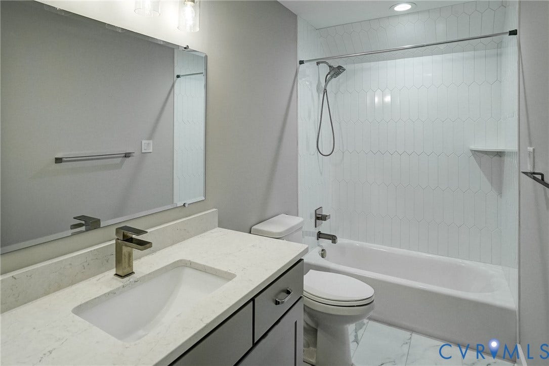 1732 Fishers Pond Drive, Maidens, VA 23102 Bathroom featuring a light gray vanity with a built-in sink and quartz-style countertop