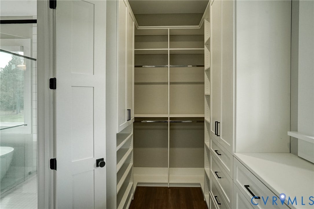 1732 Fishers Pond Drive, Maidens, VA 23102 Custom closet system featuring extensive shelving, hanging rods, and built-in drawers