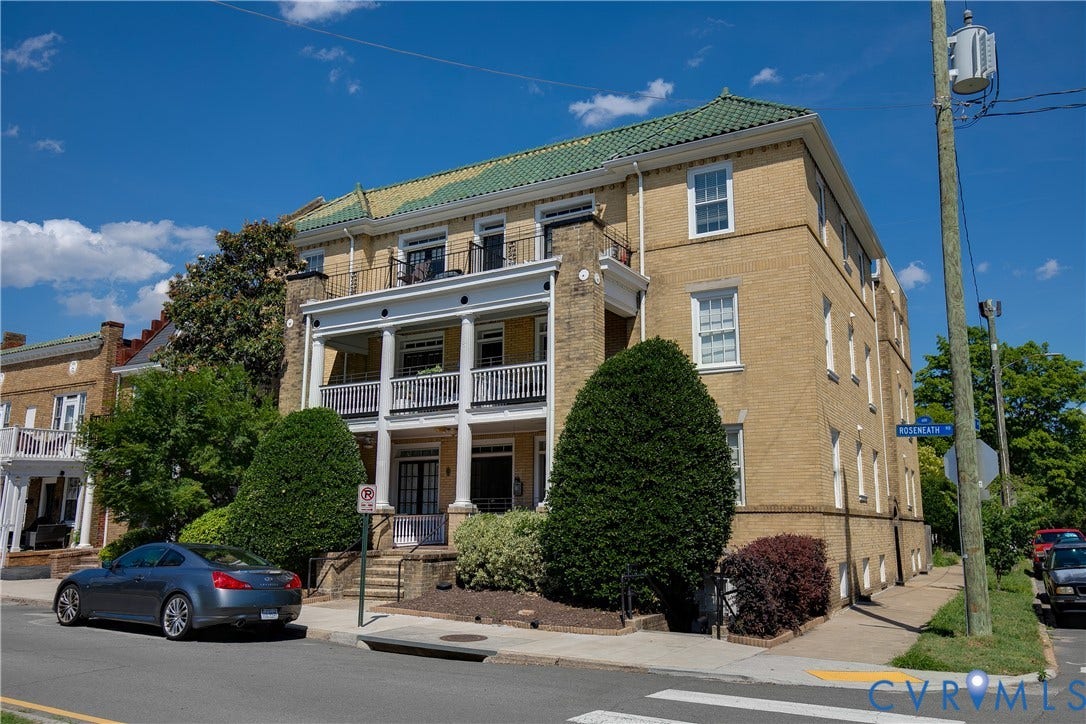 601 Roseneath Road, #U1, Museum District, Richmond, VA 23221 Multi-story building featuring brick construction, a green tile roof, and multiple balconies with white railings
