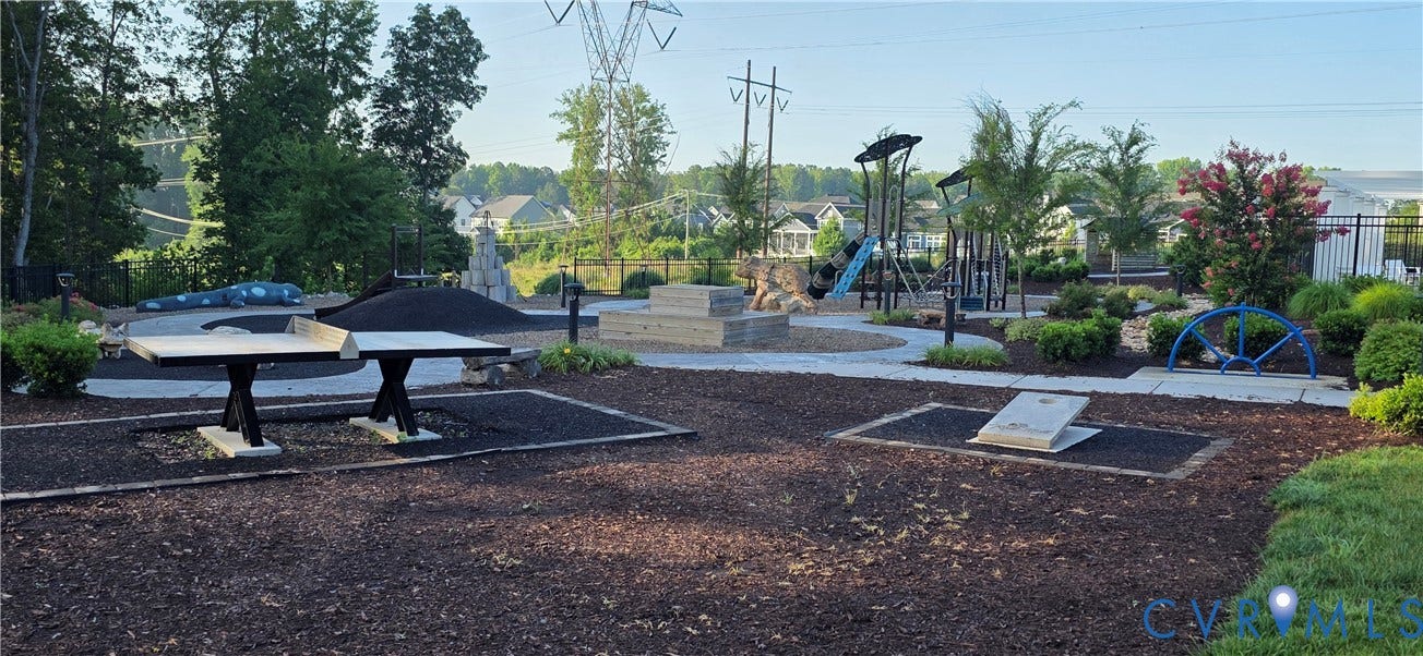 Outdoor amenity space featuring multiple activity zones