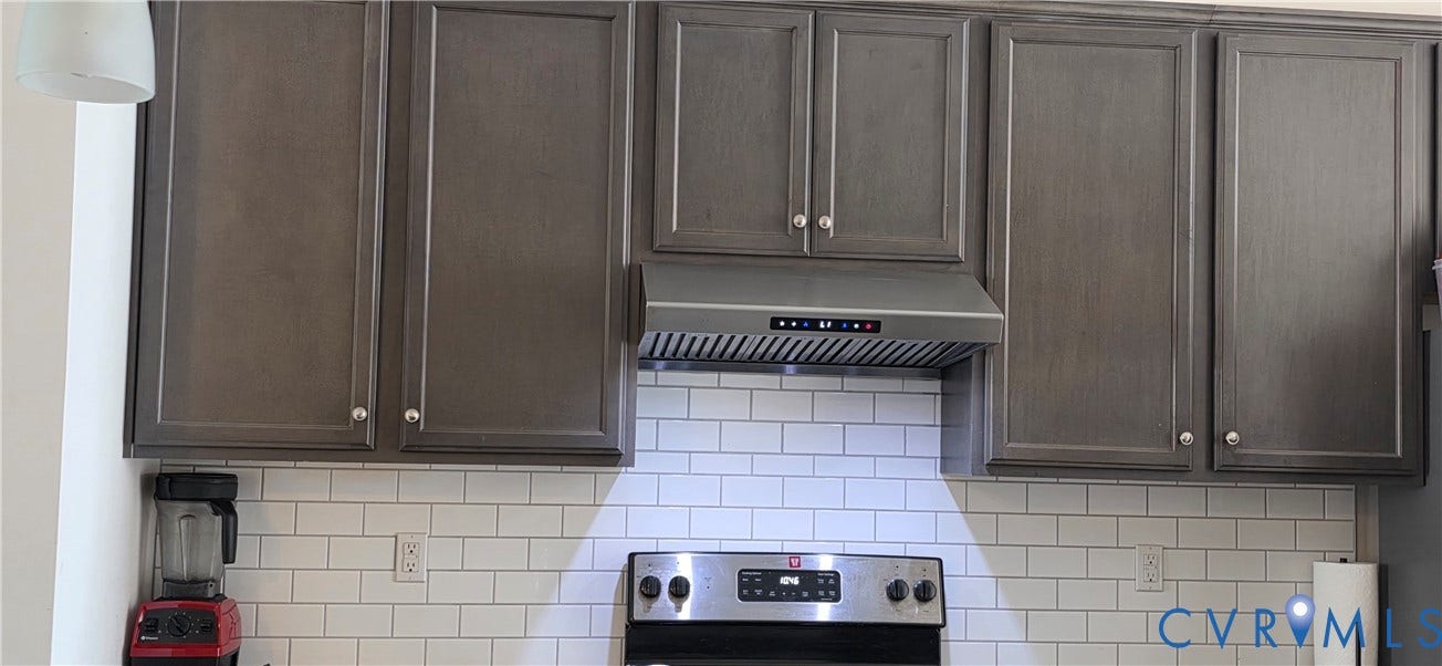 Contemporary kitchen featuring shaker-style cabinetry with brushed nickel hardware