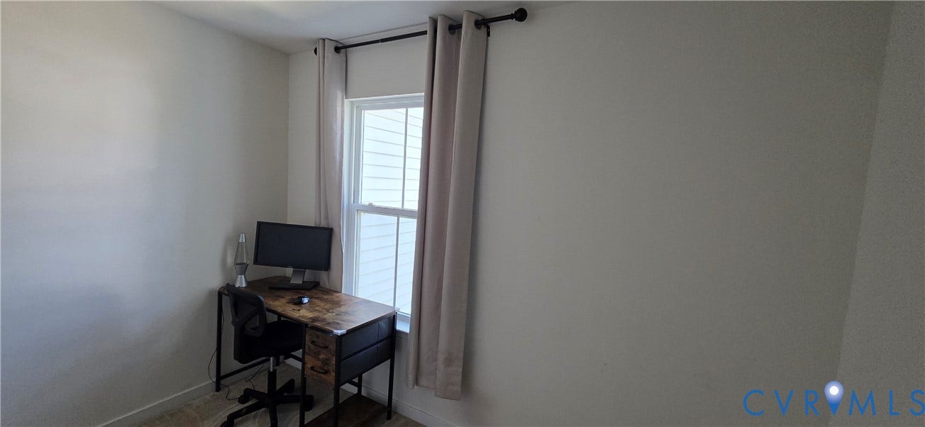 Single-hung window with white framing and light-colored wall finishes