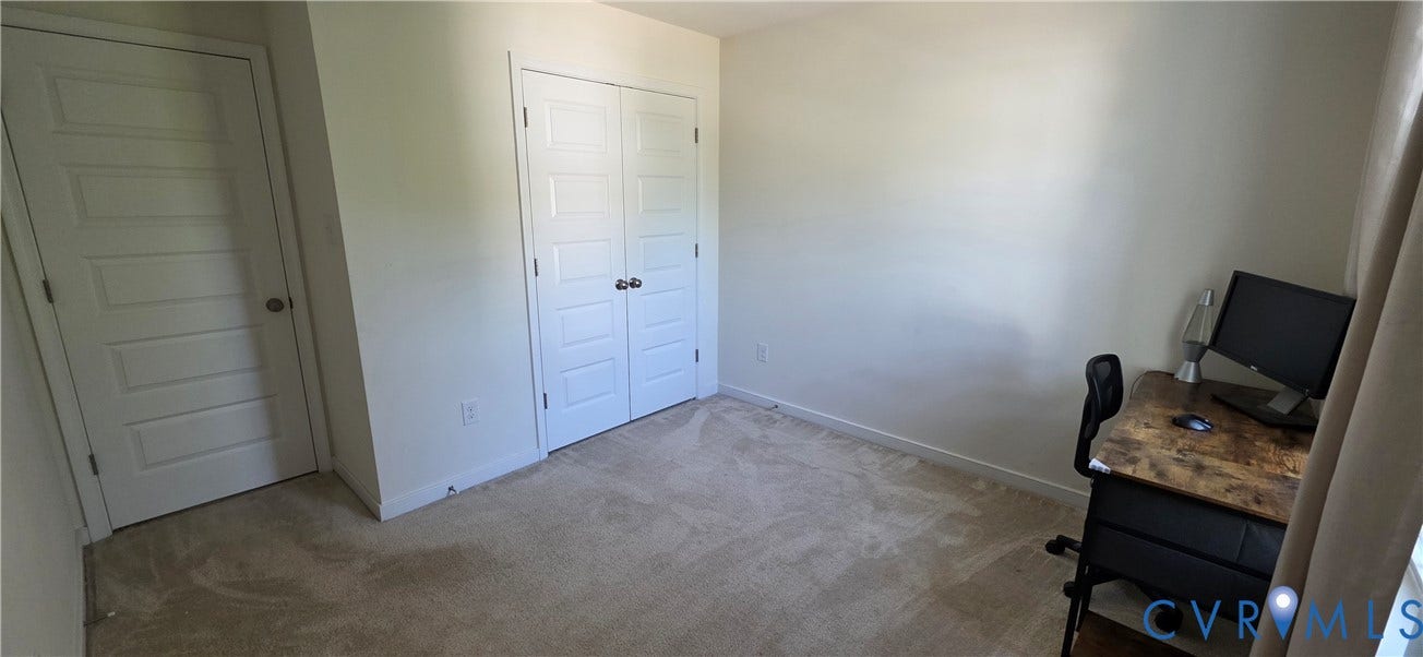 Neutral-toned carpeting throughout