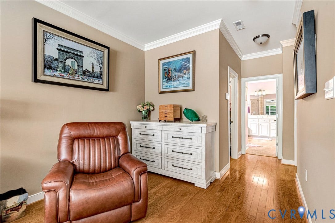 1020 Belva Court, Glen Allen, VA 23059 Hallway featuring wood-finish flooring, crown molding, and neutral wall tones