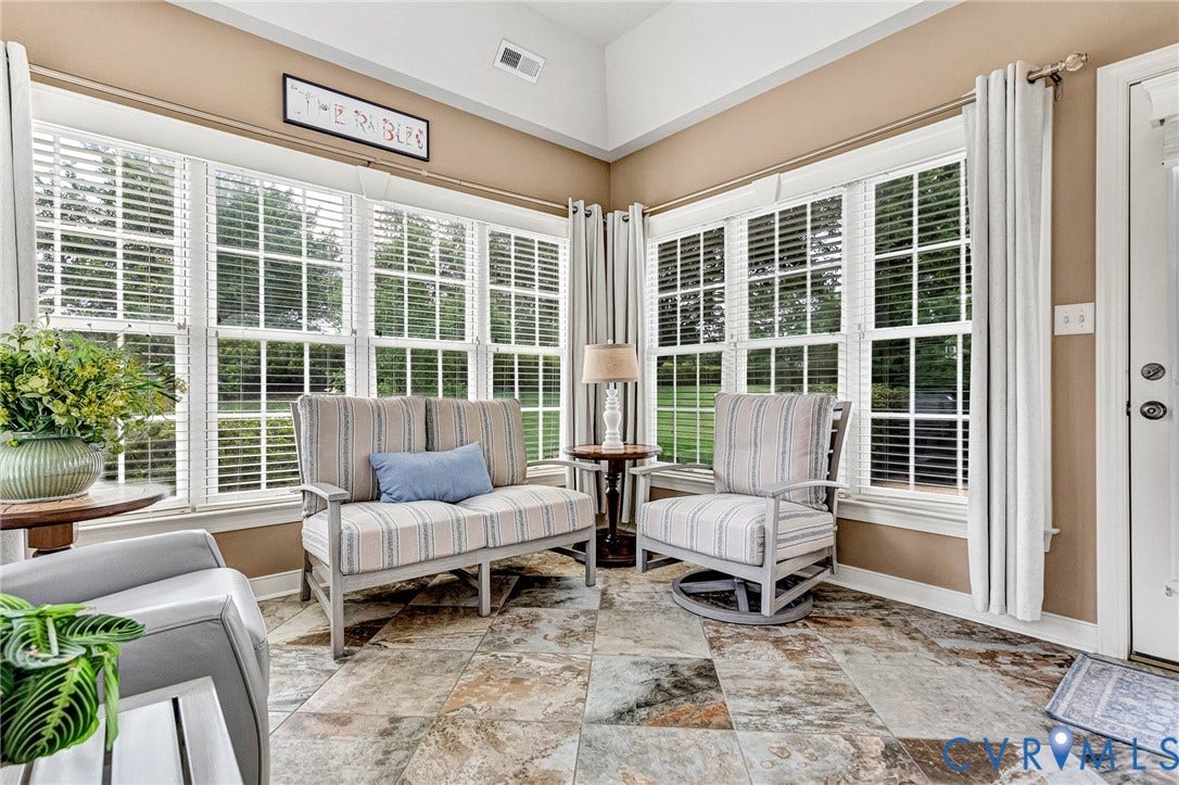 1020 Belva Court, Glen Allen, VA 23059 Sunroom featuring extensive window-lined walls with white louvered blinds, vaulted ceilings, and multi-tone natural stone tile flooring