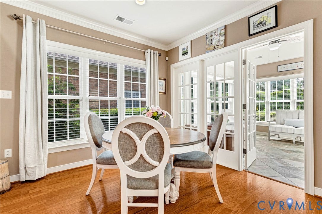 1020 Belva Court, Glen Allen, VA 23059 Hardwood flooring extending into the dining area with crown molding