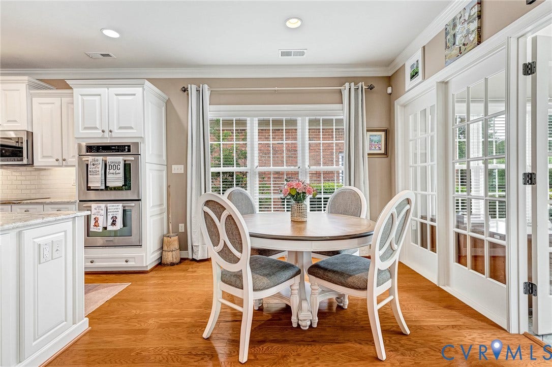 1020 Belva Court, Glen Allen, VA 23059 Dining area featuring a circular wood-top table, hardwood flooring, and French doors with glass panels