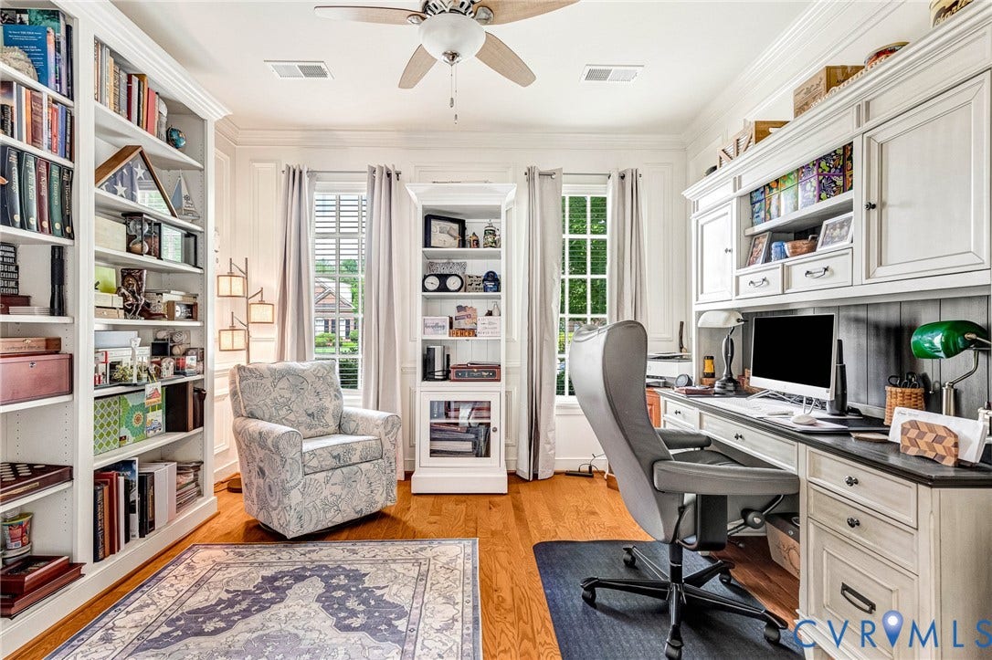 1020 Belva Court, Glen Allen, VA 23059 Home office featuring hardwood flooring, extensive built-in shelving, a ceiling fan, and two large windows