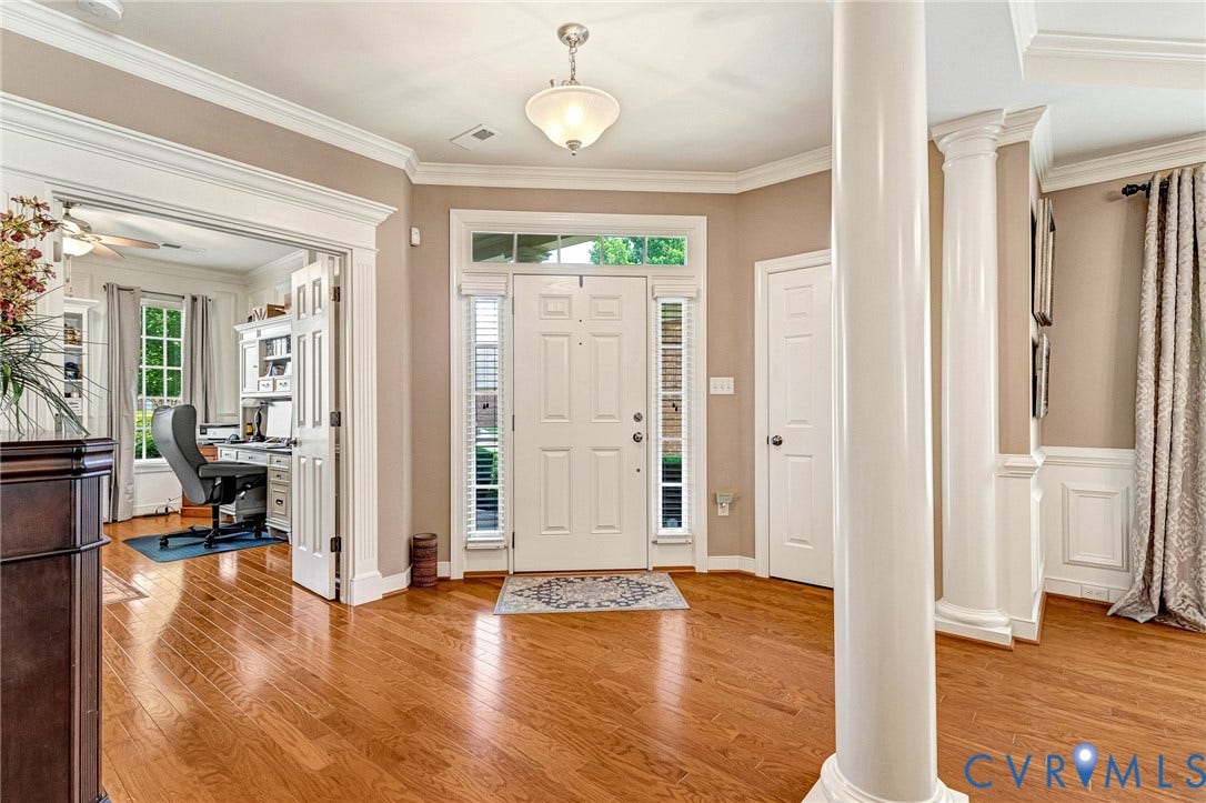 1020 Belva Court, Glen Allen, VA 23059 Foyer featuring wood-finish flooring, decorative columns, crown molding, and wainscoting