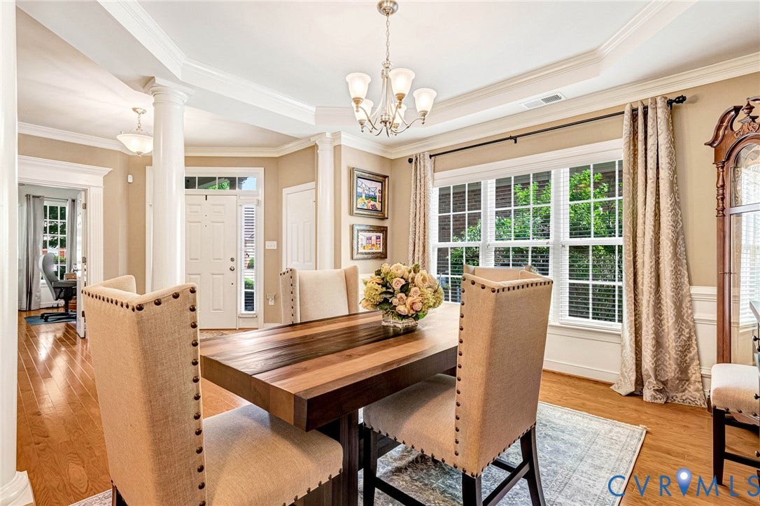 1020 Belva Court, Glen Allen, VA 23059 Formal dining area featuring rich wood-finish flooring, a tray ceiling, and an elegant chandelier