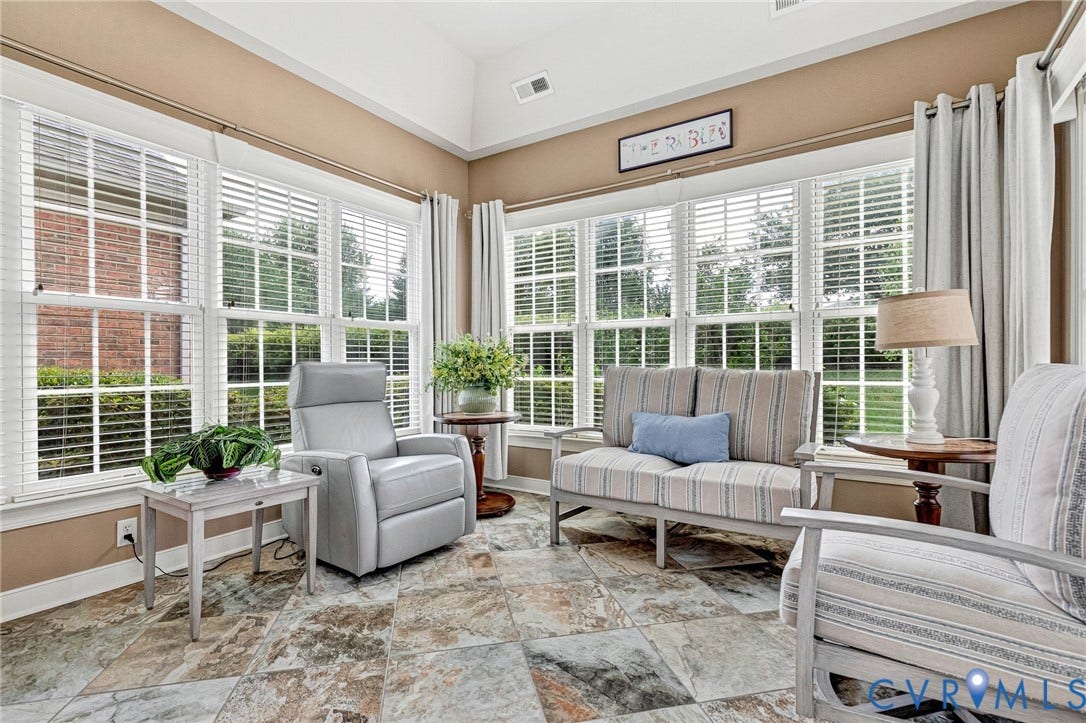 1020 Belva Court, Glen Allen, VA 23059 Sunroom featuring expansive windows with white blinds, neutral paint, a vaulted ceiling, and patterned tile flooring