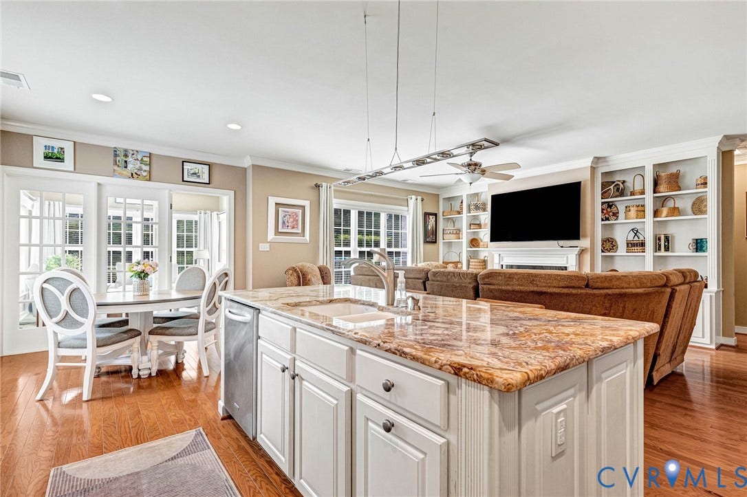 1020 Belva Court, Glen Allen, VA 23059 Kitchen island with a granite countertop and integrated sink, stainless steel dishwasher, white cabinetry, hardwood flooring, and French doors