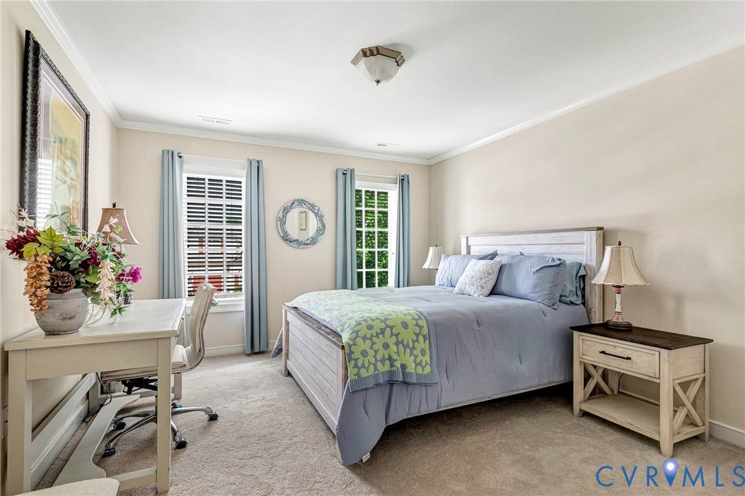 1020 Belva Court, Glen Allen, VA 23059 Carpeted bedroom featuring two windows with white blinds, crown molding, and neutral wall paint