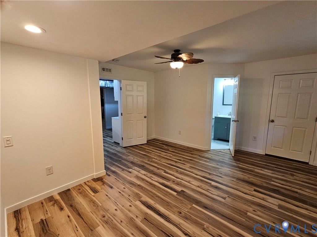 14600 Ramblewood Drive, Chester, VA 23836 Wood-finish flooring, recessed lighting, and a ceiling fan with integrated light