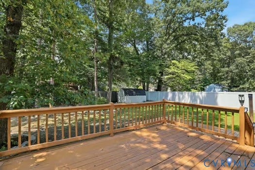 2804 Executive Drive, John Tyler Woods, Chester, VA 23831 Expansive outdoor wooden deck with natural wood railing overlooking a private backyard