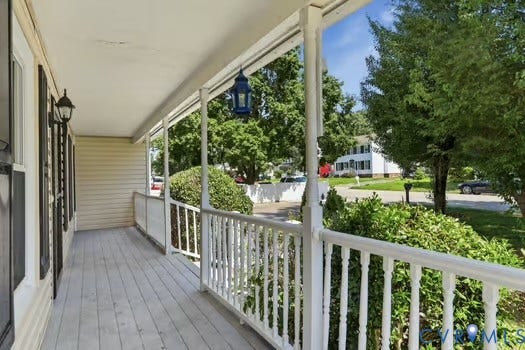 2804 Executive Drive, John Tyler Woods, Chester, VA 23831 Covered front porch featuring trek type flooring, white vinyl railings, and a vinyl siding exterior
