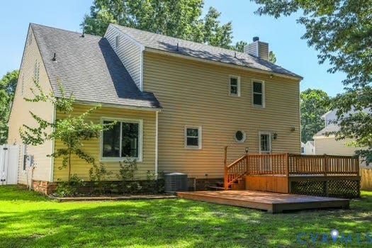 2804 Executive Drive, John Tyler Woods, Chester, VA 23831 Rear exterior featuring a multi-level wood deck, ground-level wood patio, and a fenced yard