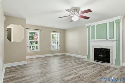 2804 Executive Drive, John Tyler Woods, Chester, VA 23831 Living area featuring a fireplace with a decorative mantel, LVP flooring, and a ceiling fan