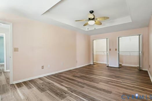 2804 Executive Drive, John Tyler Woods, Chester, VA 23831 Spacious room featuring LVP flooring, a tray ceiling, and a ceiling fan with integrated lighting