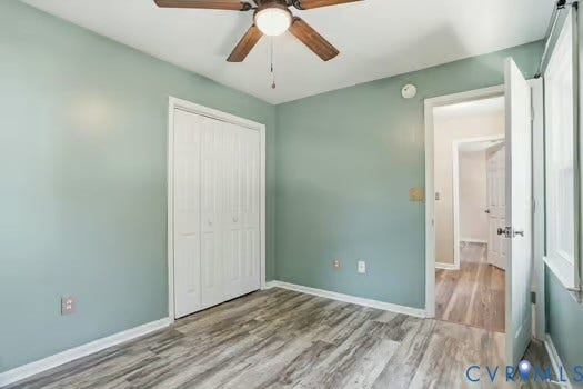 2804 Executive Drive, John Tyler Woods, Chester, VA 23831 Room featuring LVP flooring, a new ceiling fan, and light green walls