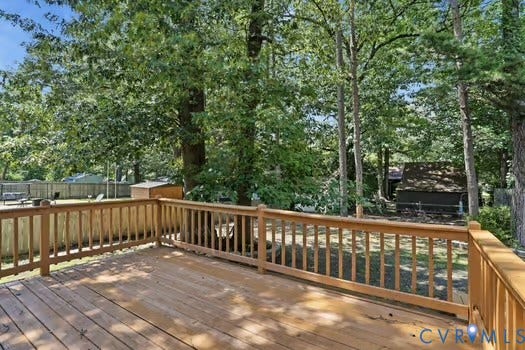 2804 Executive Drive, John Tyler Woods, Chester, VA 23831 Spacious wood deck with railing overlooking a treed backyard