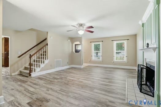 2804 Executive Drive, John Tyler Woods, Chester, VA 23831 Spacious living area featuring LVP flooring, a ceiling fan, and two windows with blinds